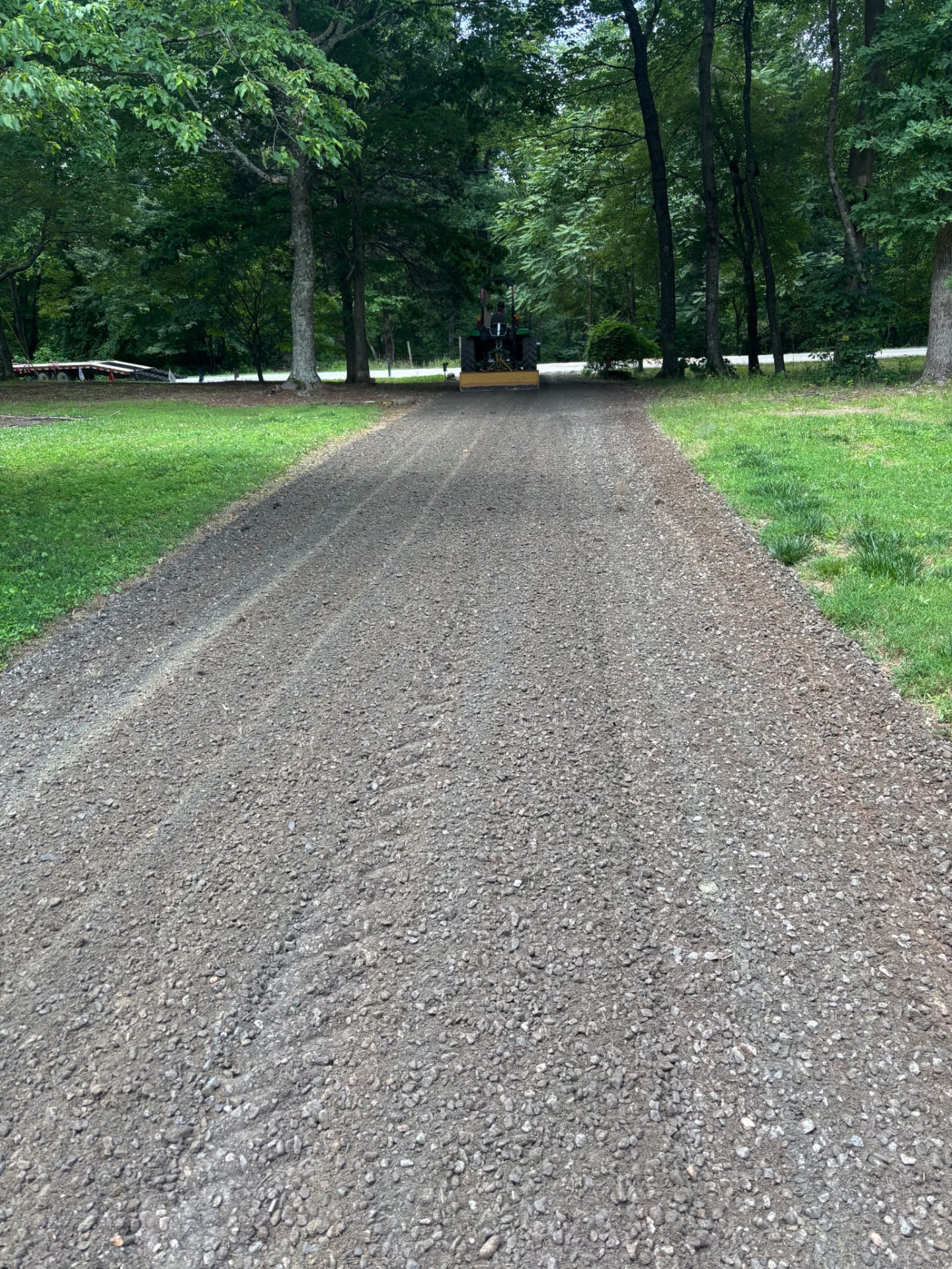 Finished gravel driveway under the trees